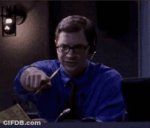 Man In Blue Shirt And Tie Pointing With Pen GIF