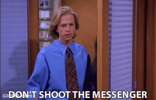 Man In Blue Shirt And Tie Saying Don't Shoot The Messenger GIF