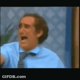 Man In Blue Shirt And Tie Screaming GIF