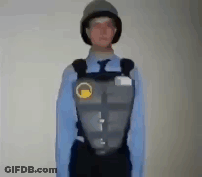 Man In Blue Shirt And Tie With Helmet And Vest GIF