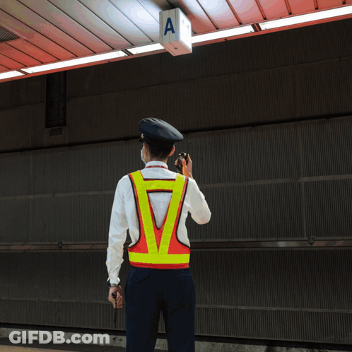 Man In Blue Shirt And Tie With KB Patch GIF