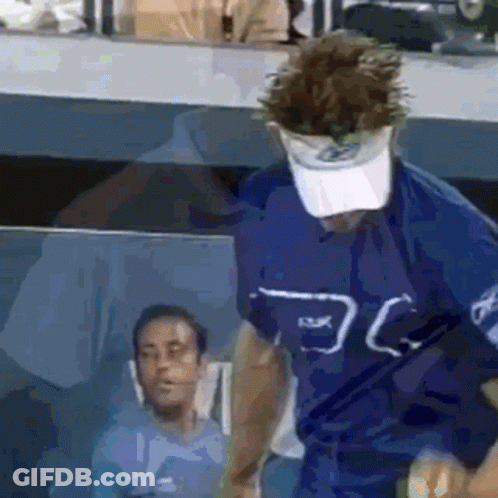 Man In Blue Shirt And Visor GIF