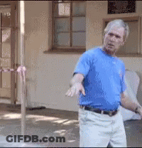 Man In Blue Shirt And White Pants GIF