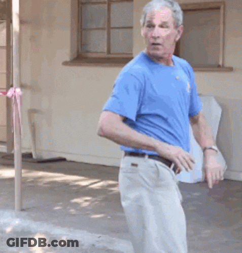 Man In Blue Shirt And White Pants GIF