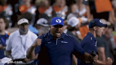 Man In Blue Shirt And White Shorts In Stadium GIF