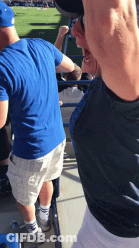 Man In Blue Shirt And White Shorts In Stadium GIF