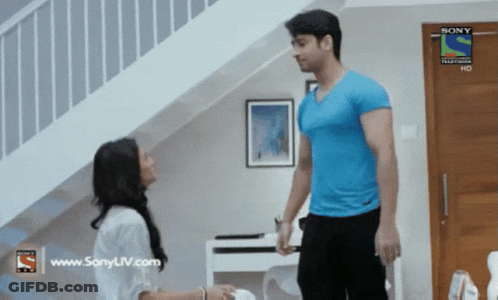 Man In Blue Shirt And Woman In White Shirt With Sony TV Logo GIF