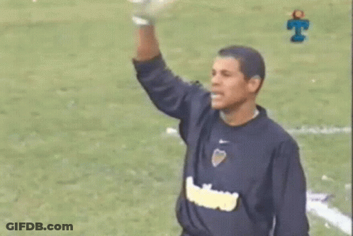 Man In Blue Shirt Arm Up Soccer Field GIF