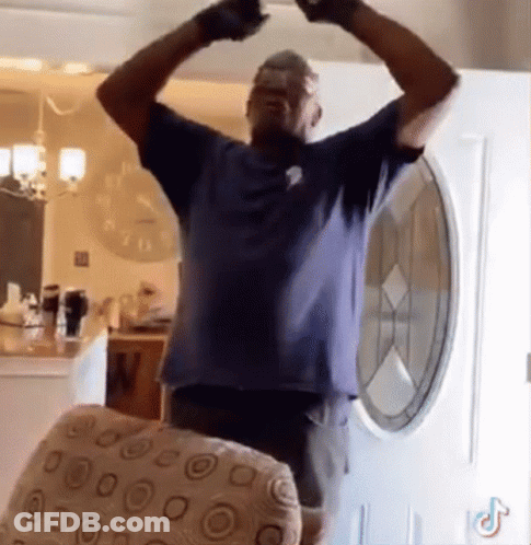 Man In Blue Shirt Arms Outstretched GIF