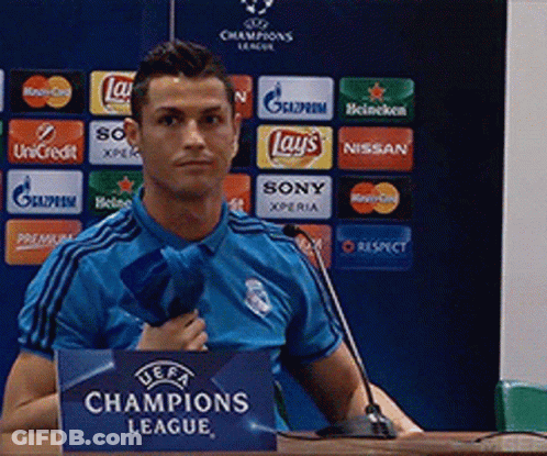 Man In Blue Shirt At Champions League Sign GIF