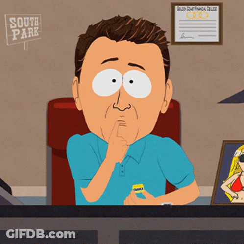 Man In Blue Shirt At Desk In Front Of South Park Sign GIF