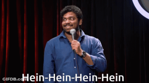 Man In Blue Shirt At Microphone Saying Hein-Hein-Hein GIF