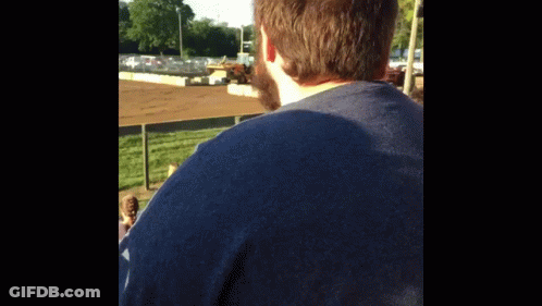 Man In Blue Shirt At Race Track GIF