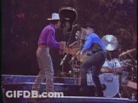 Man In Blue Shirt By Stove GIF