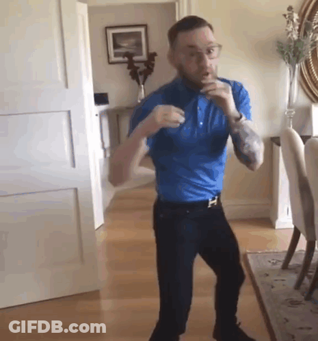 Man In Blue Shirt Dancing GIF