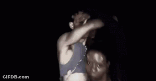 Man In Blue Shirt Dancing In Dark GIF