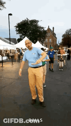 Man In Blue Shirt Dancing In Front Of Crowd Saying Balls GIF