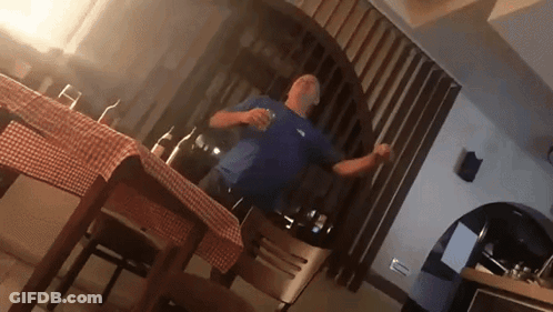 Man In Blue Shirt Dancing In Kitchen GIF
