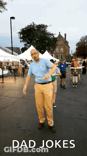 Man In Blue Shirt Dancing In Parking Lot Dad Jokes GIF