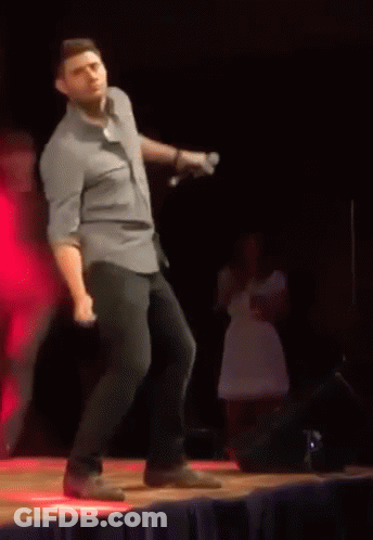 Man In Blue Shirt Dancing On Stage GIF