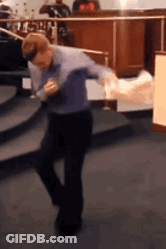Man In Blue Shirt Dancing On Stage GIF