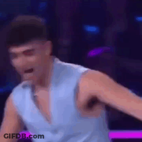 Man In Blue Shirt Dancing On Stage GIF