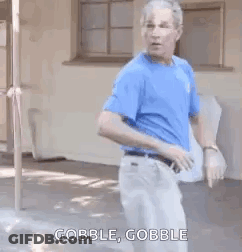 Man In Blue Shirt Dancing Saying Gobble GIF