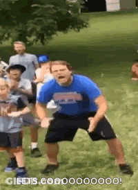 Man In Blue Shirt Dancing With Children GIF