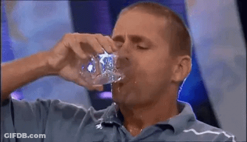 Man In Blue Shirt Drinking From Bottle GIF