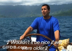 Man In Blue Shirt Driving Boat Saying Wouldn't It Be Nice If We Were Older GIF