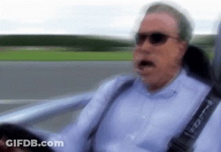 Man In Blue Shirt Driving Car GIF