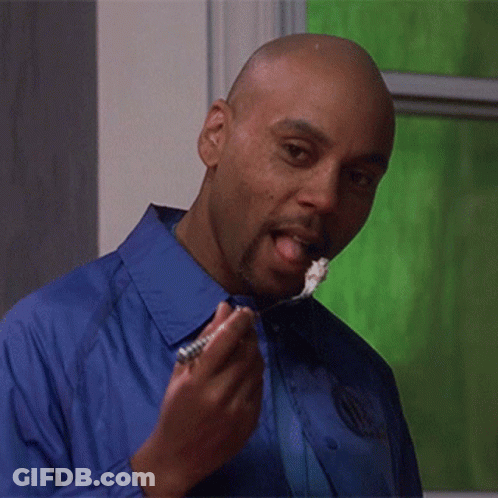 Man In Blue Shirt Eating With Tongue Out GIF