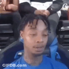 Man In Blue Shirt Eyes Closed Funny Face In Stadium GIF