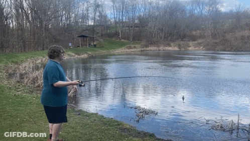 Man In Blue Shirt Fishing GIF
