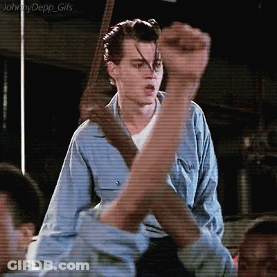 Man In Blue Shirt Fist Up In Air GIF