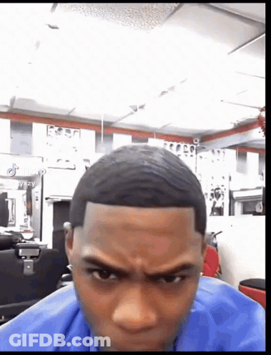 Man In Blue Shirt Getting Haircut GIF