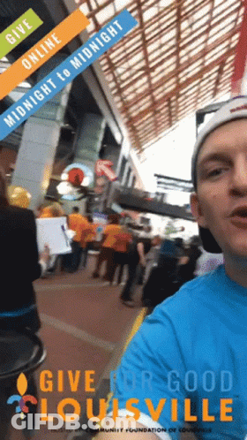 Man In Blue Shirt Give For Good Louisville In Front Of Crowd GIF