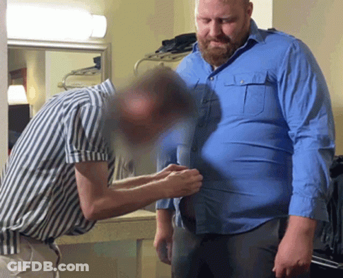 Man In Blue Shirt Helped By Striped Shirt Man GIF