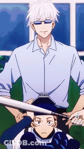 Man In Blue Shirt Holding Bat Over Another GIF