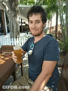 Man In Blue Shirt Holding Beer GIF