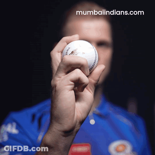 Man In Blue Shirt Holding Cricket Ball GIF