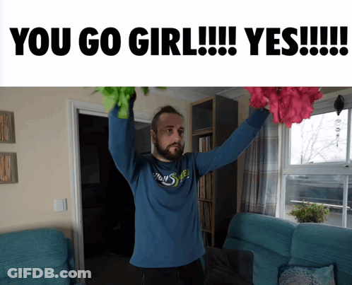 Man In Blue Shirt Holding Flowers GIF