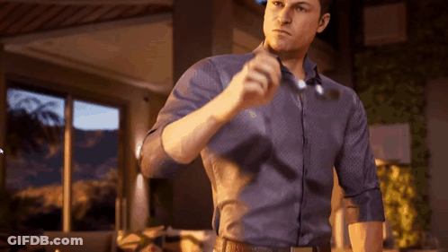 Man In Blue Shirt Holding Glasses GIF