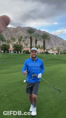 Man In Blue Shirt Holding Golf Club GIF