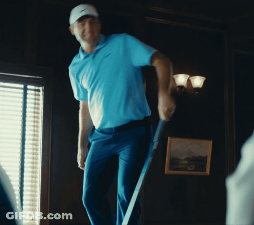 Man In Blue Shirt Holding Golf Club GIF