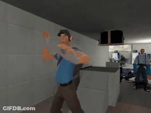 Man In Blue Shirt Holding Gun GIF