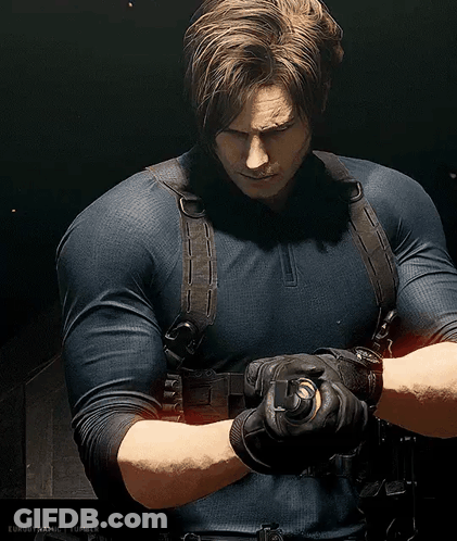 Man In Blue Shirt Holding Gun GIF