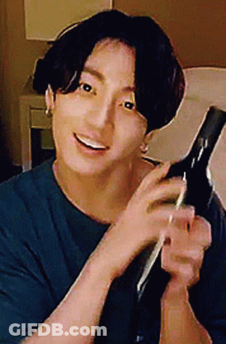 Man In Blue Shirt Holding Hair Dryer GIF