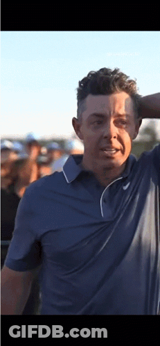 Man In Blue Shirt Holding Head GIF