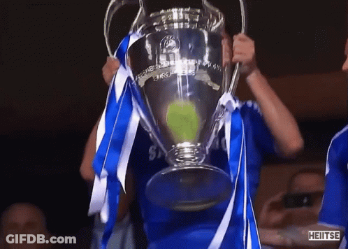 Man In Blue Shirt Holding Heitse Trophy GIF